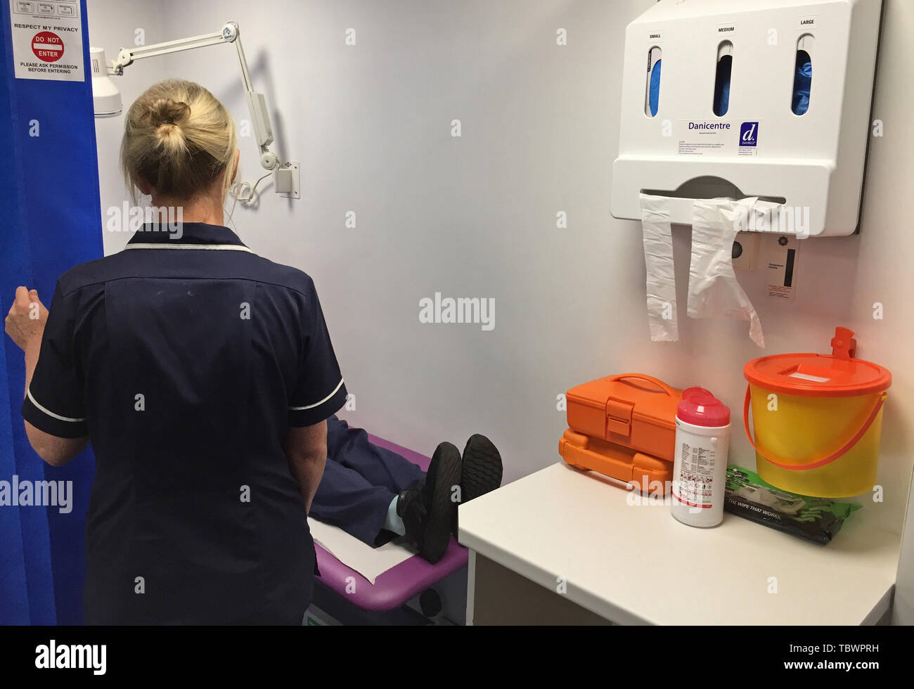 A nurse at work inside a custody suit at Musgrave Street PSNI station