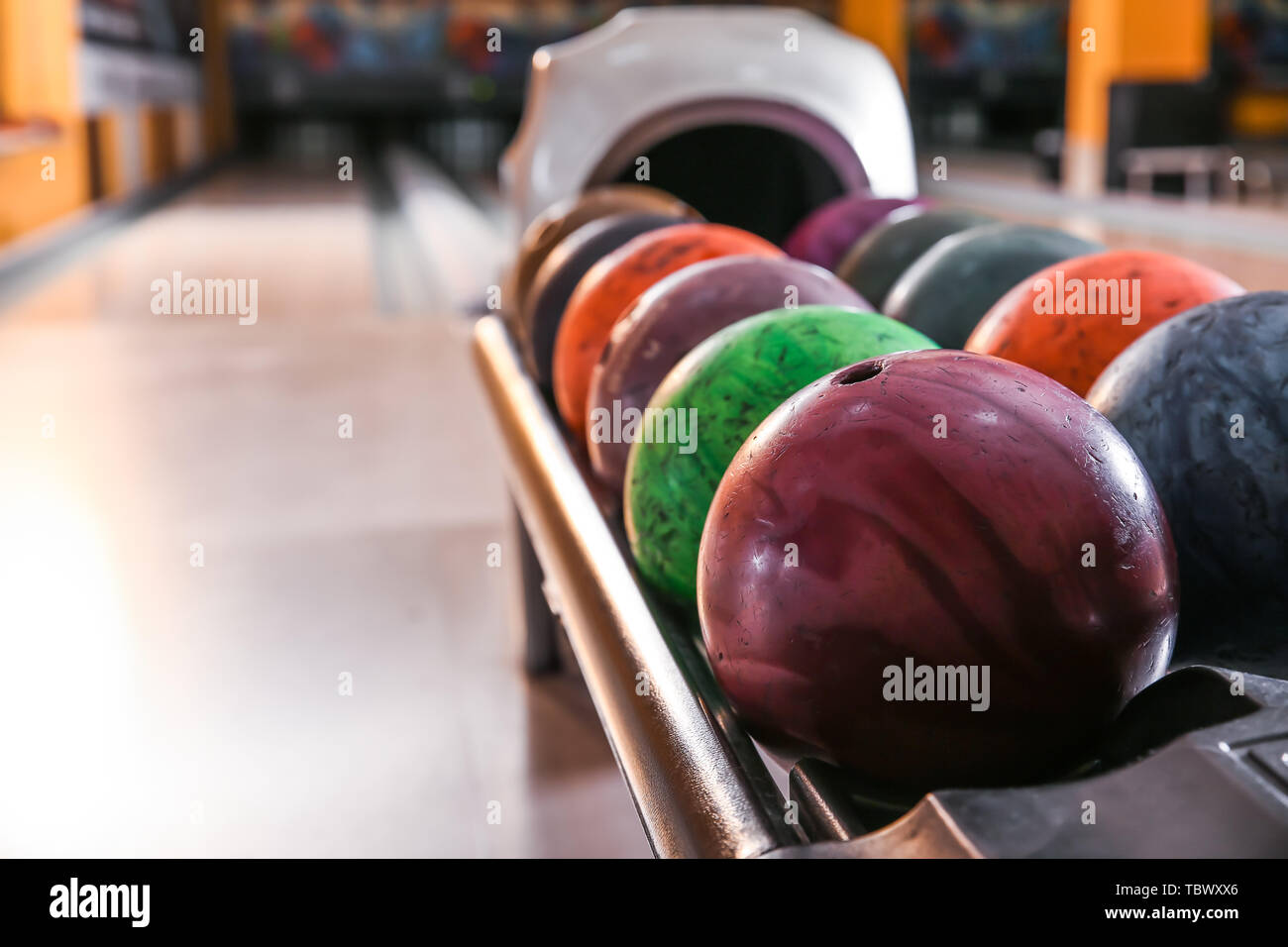 Stand with balls in bowling club Stock Photo Alamy