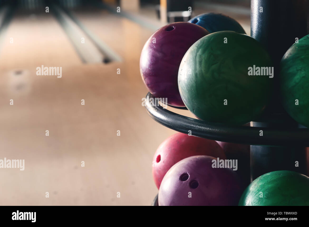 Stand with balls in bowling club Stock Photo Alamy