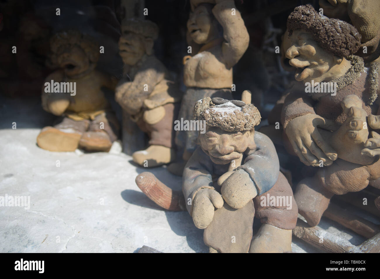 Carving statues, artwork Stock Photo Alamy
