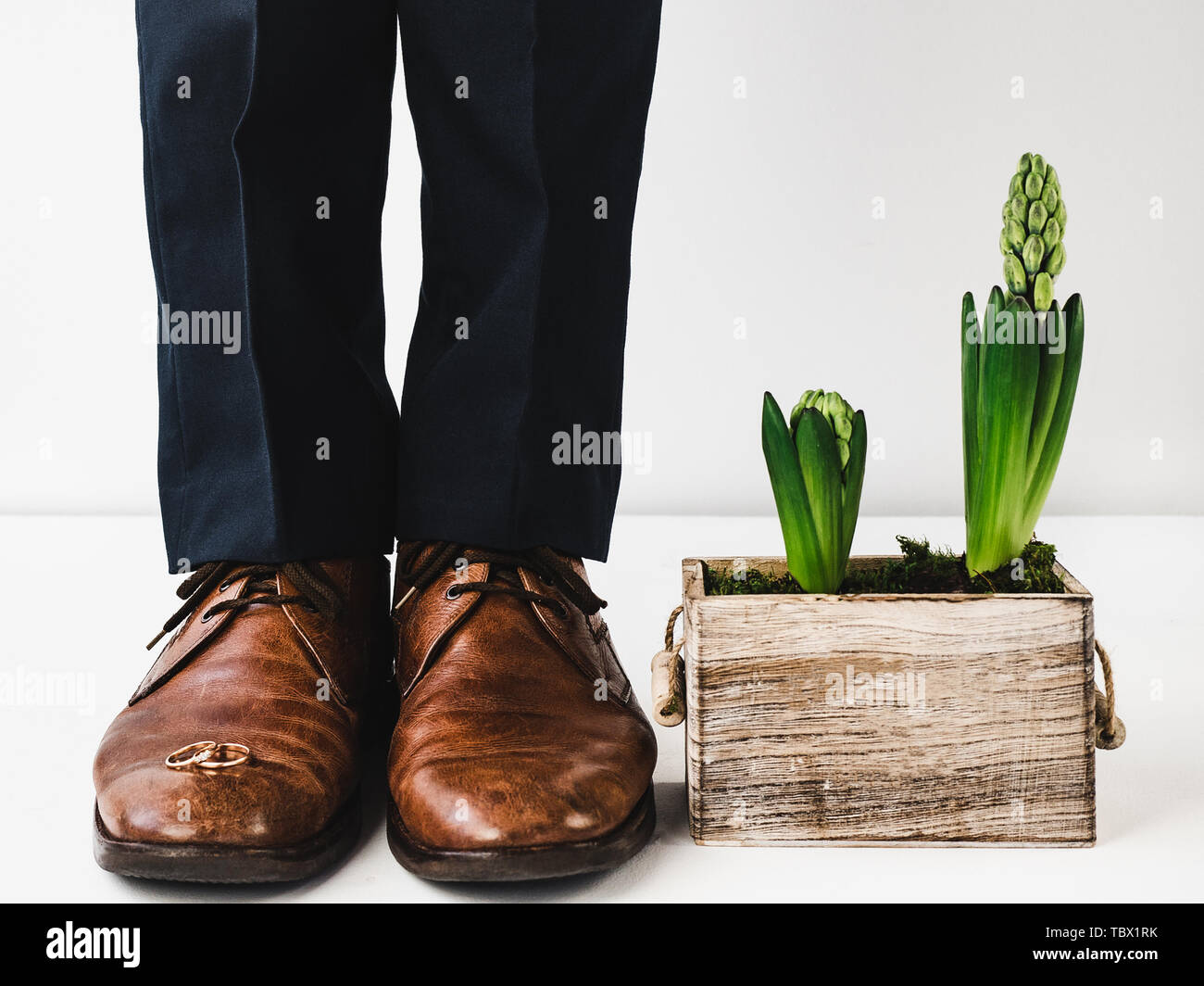 Office manager standing in stylish shoes, black pants and bright ...
