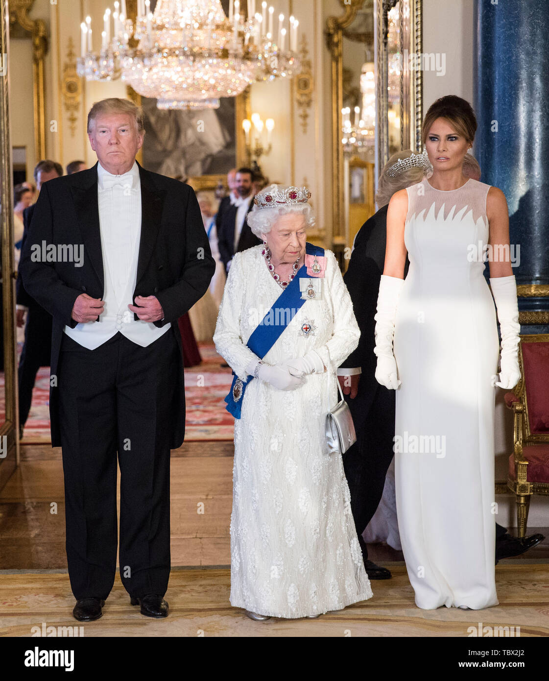 left to right) US President Donald Trump, Queen Elizabeth II and Melania  Trump, during a group photo ahead of the State Banquet at Buckingham  Palace, London, on day one of US President