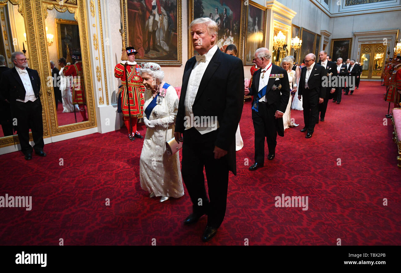 Queen Elizabeth II, US President Donald Trump and the Prince of Wales arrive through the East Gallery during the State Banquet at Buckingham Palace, London, on day one of the US President's three day state visit to the UK. Stock Photo