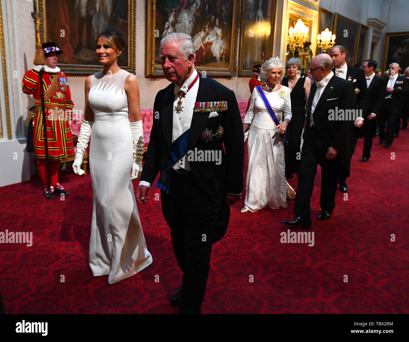 Melania Trump and the Prince of Wales arrive through the East Gallery during the State Banquet at Buckingham Palace, London, on day one of the US President's three day state visit to the UK. Stock Photo
