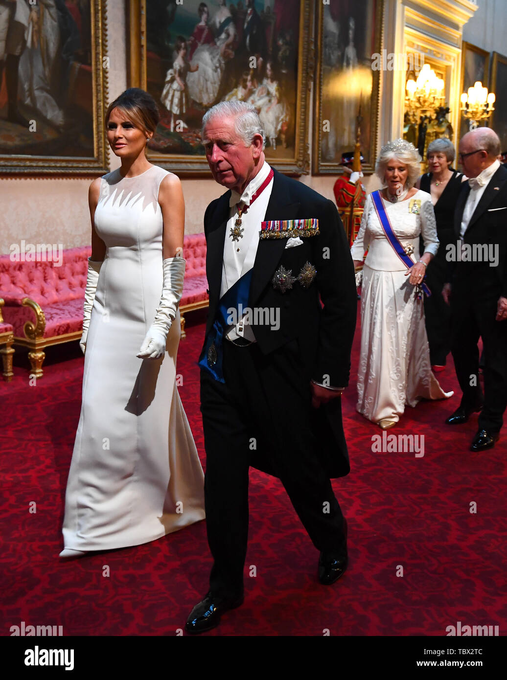 Melania Trump and the Prince of Wales arrive through the East Gallery during the State Banquet at Buckingham Palace, London, on day one of the US President's three day state visit to the UK. Stock Photo