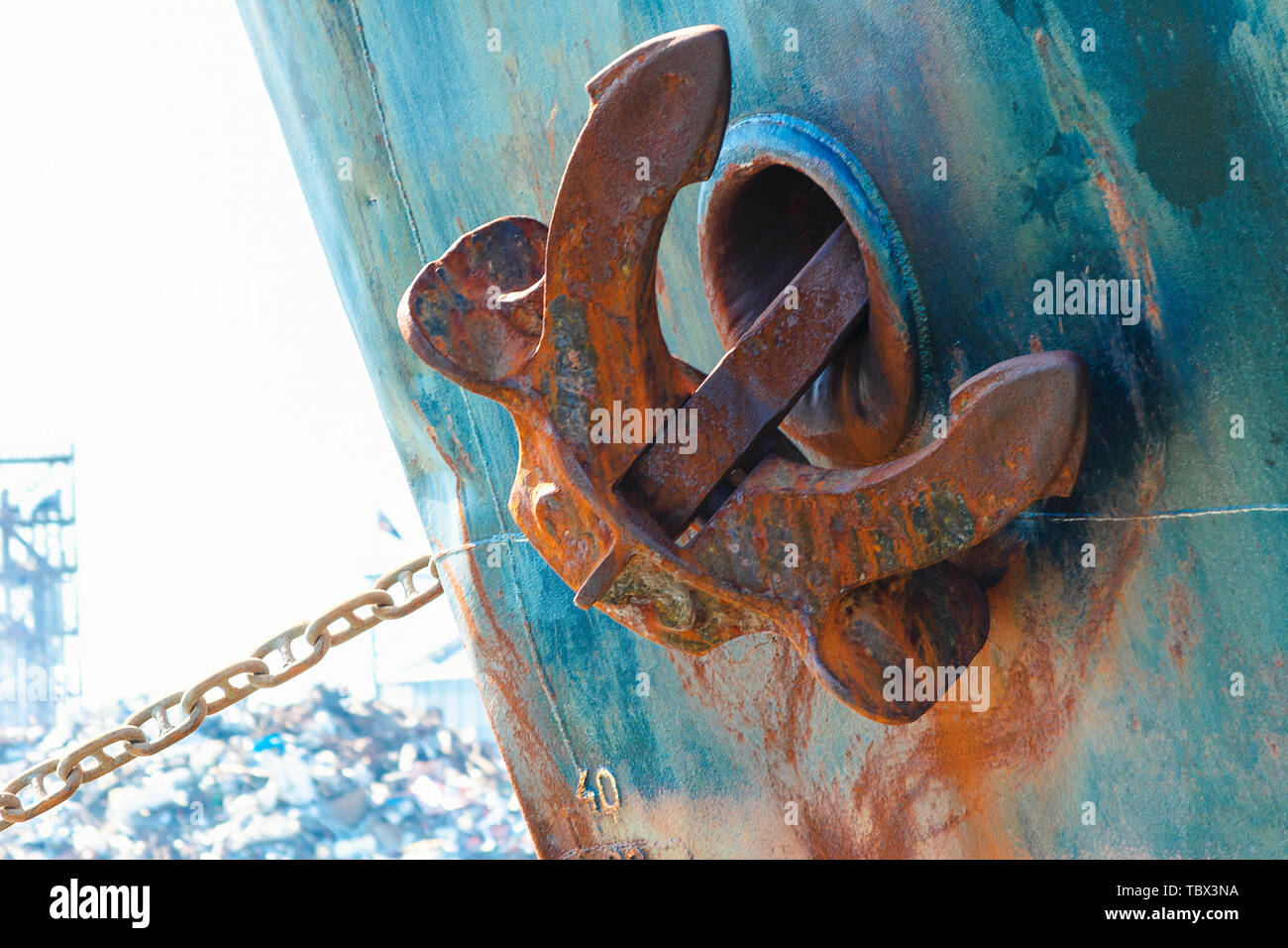 ship anchor in up position. Heavy metal anchor on the side of the ship. Stock Photo