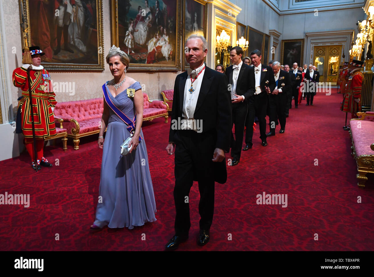 The Countess of Wessex and the Chancellor of the Duchy of Lancaster, David Lidington arrive through the East Gallery during the State Banquet at Buckingham Palace, London, on day one of the US President's three day state visit to the UK. Stock Photo