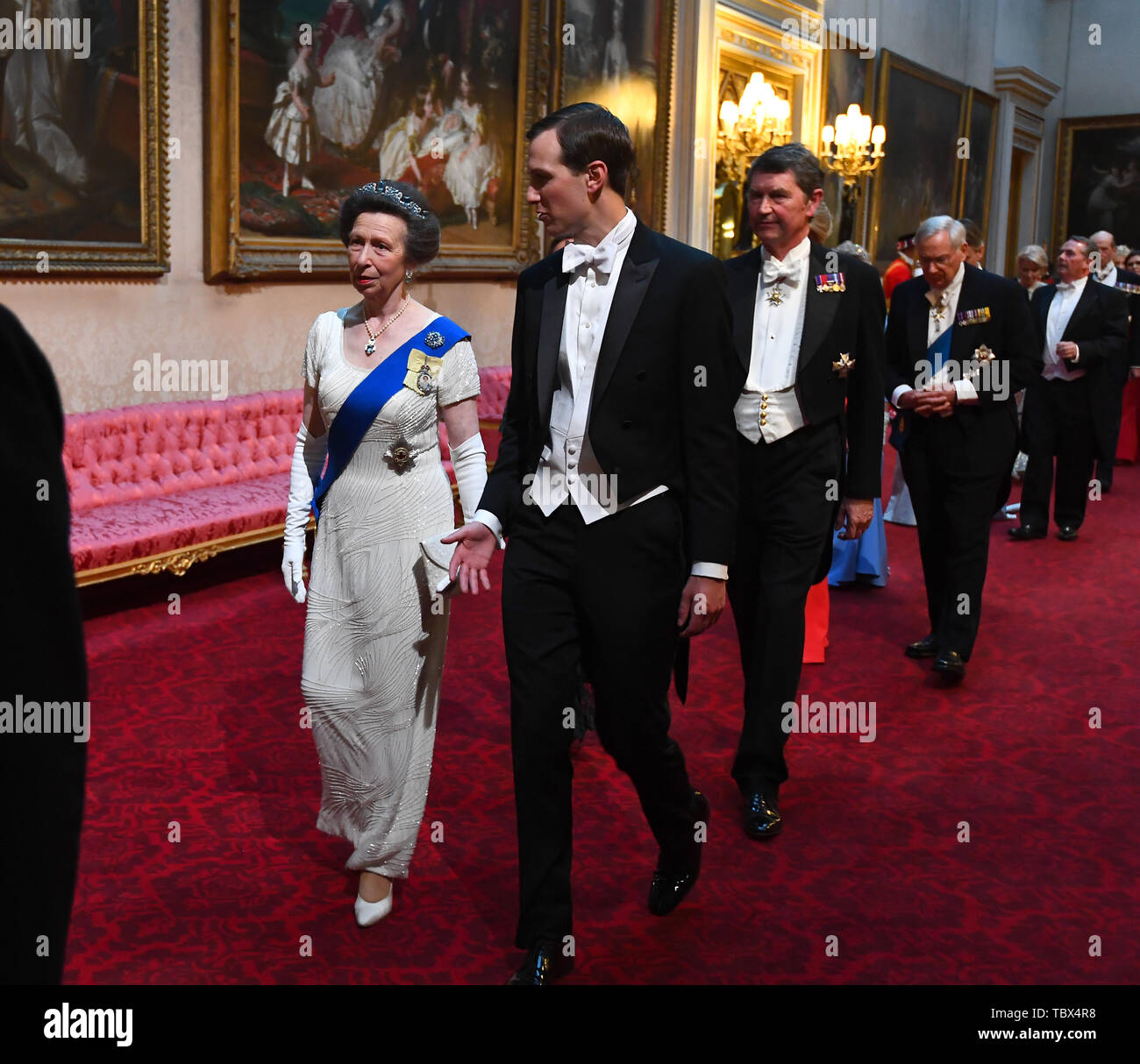 The Princess Royal and Jared Kushner arrive through the East Gallery during the State Banquet at Buckingham Palace, London, on day one of the US President's three day state visit to the UK. Stock Photo