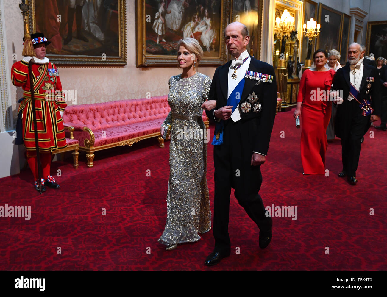 Kellyanne Conway and The Duke of Kent arrive through the East Gallery during the State Banquet at Buckingham Palace, London, on day one of the US President's three day state visit to the UK. Stock Photo