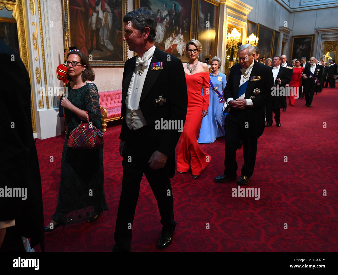Leader of the House of Lords, Baroness Evans and Vice Admiral Sir Timothy Laurence arrive through the East Gallery during the State Banquet at Buckingham Palace, London, on day one of the US President's three day state visit to the UK. Stock Photo