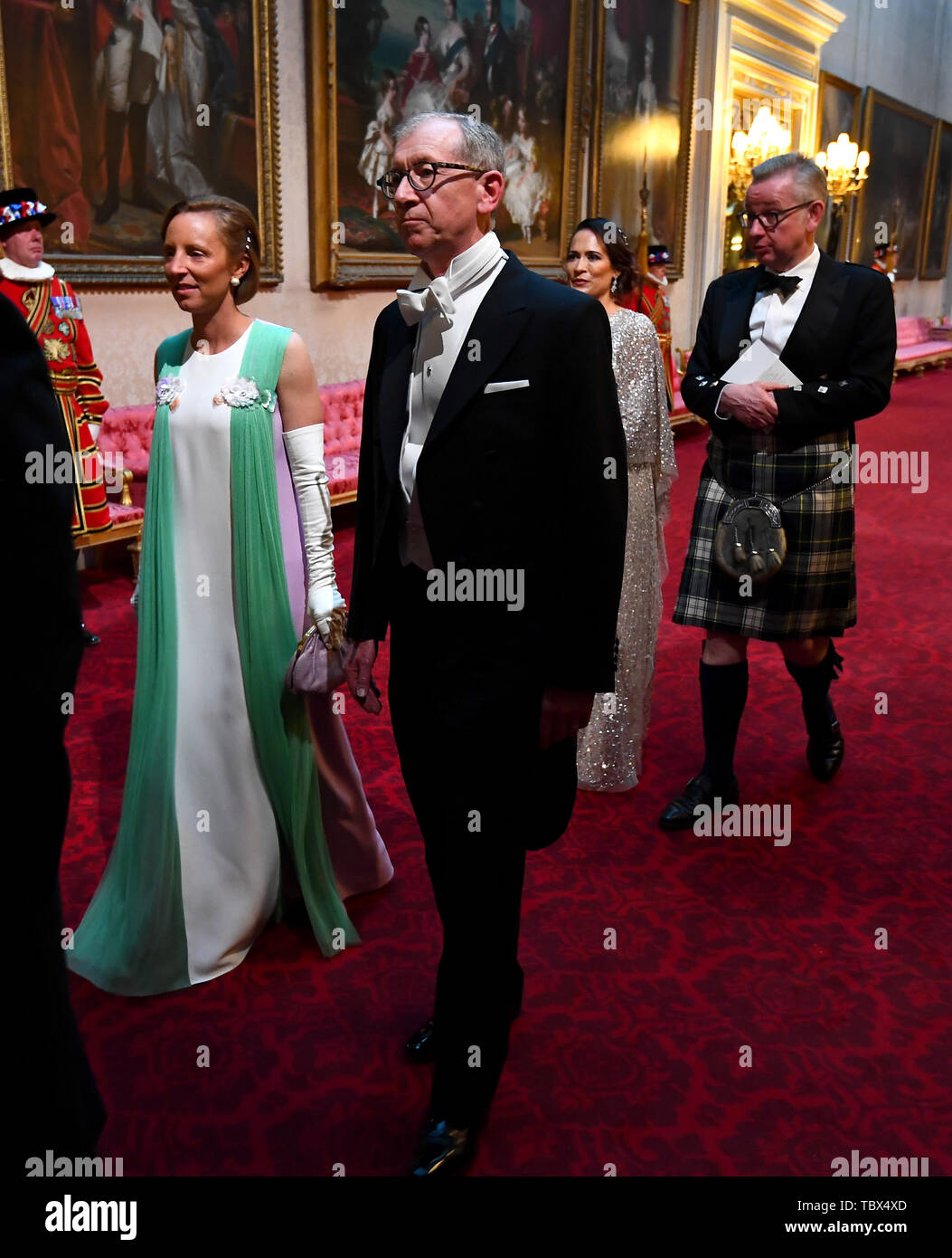 Lindsay Reynolds and the Prime Minister's husband Philip May arrive through the East Gallery during the State Banquet at Buckingham Palace, London, on day one of the US President's three day state visit to the UK. Stock Photo