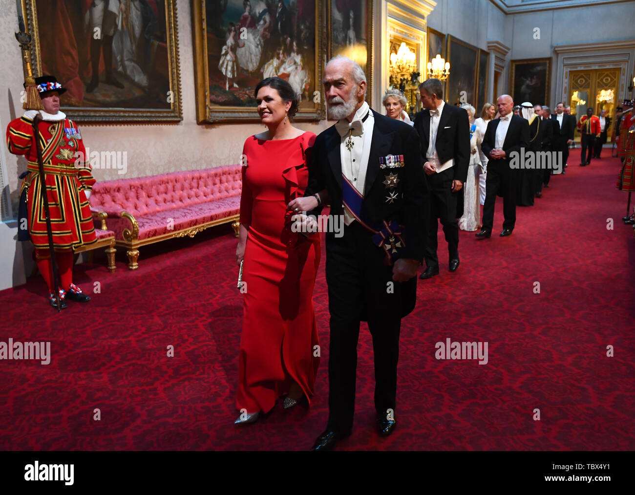 Sara Huckabee Sanders and Prince Michael of Kent arrive through the East Gallery during the State Banquet at Buckingham Palace, London, on day one of the US President's three day state visit to the UK. Stock Photo