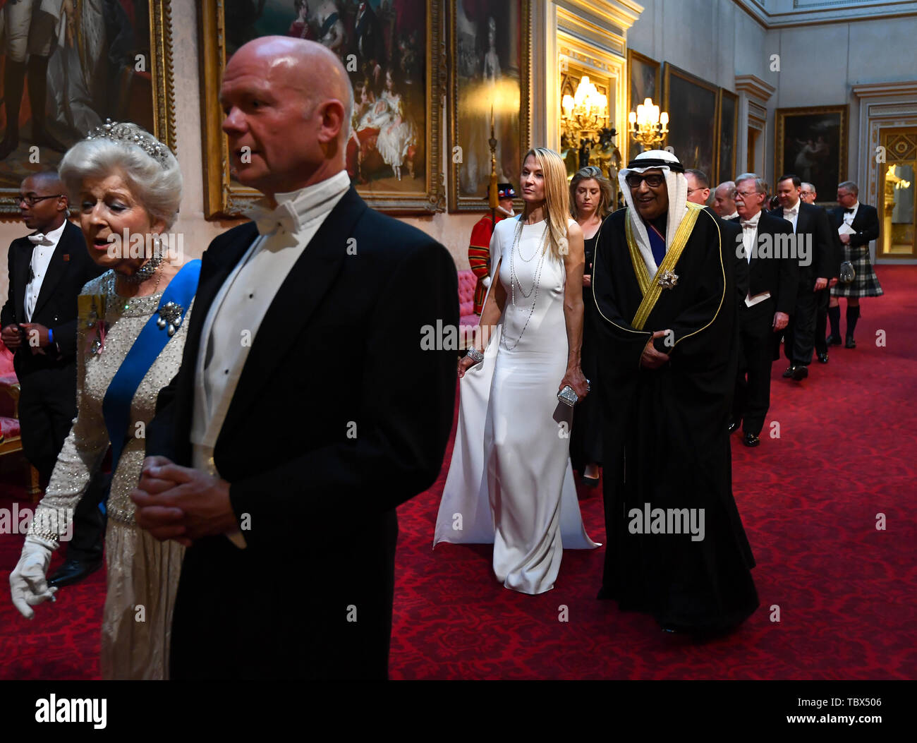 Princess Alexandra, The Honourable Lady Ogilvy and Lord Hague of Richmond, followed by Suzanne Ircha and the Ambassador of Kuwait arrive through the East Gallery during the State Banquet at Buckingham Palace, London, on day one of the US President's three day state visit to the UK. Stock Photo