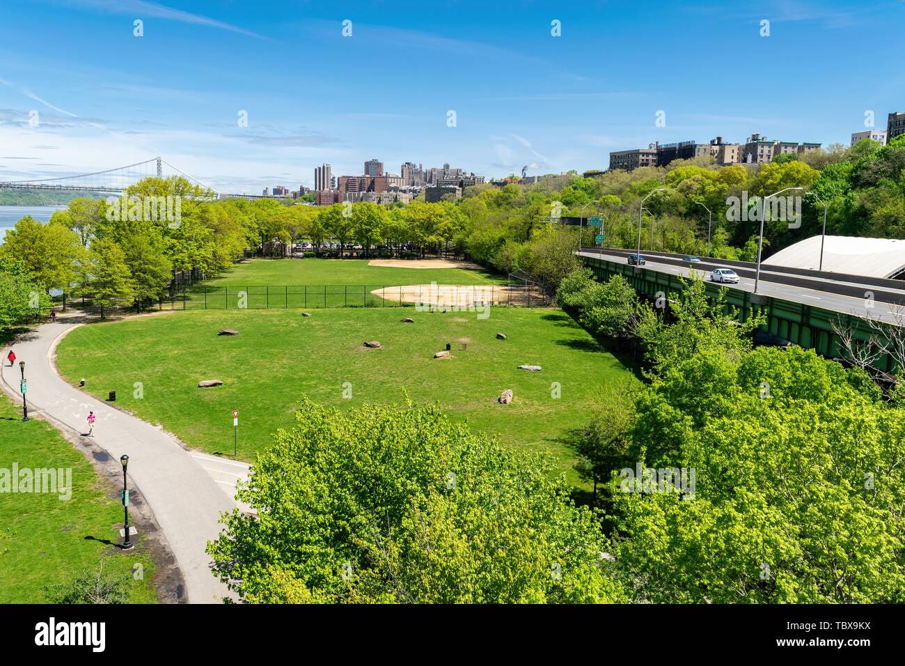Arial view across Riverbank State Park in New York City with Upper Manhattan and the George Washington Bridge in the background Stock Photo