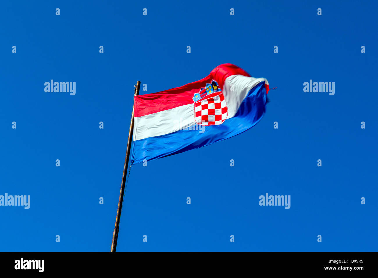 red-white-blue-flag-of-croatia-against-blue-sky-stock-photo-alamy