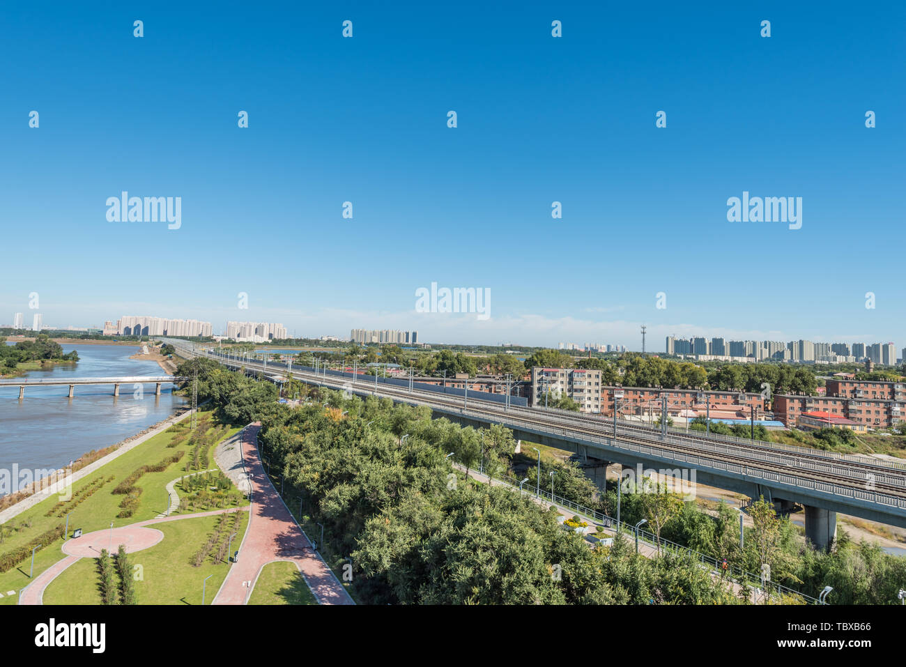 Songhua River Railway Bridge under Autumn Sunny Day in Harbin, China Stock Photo