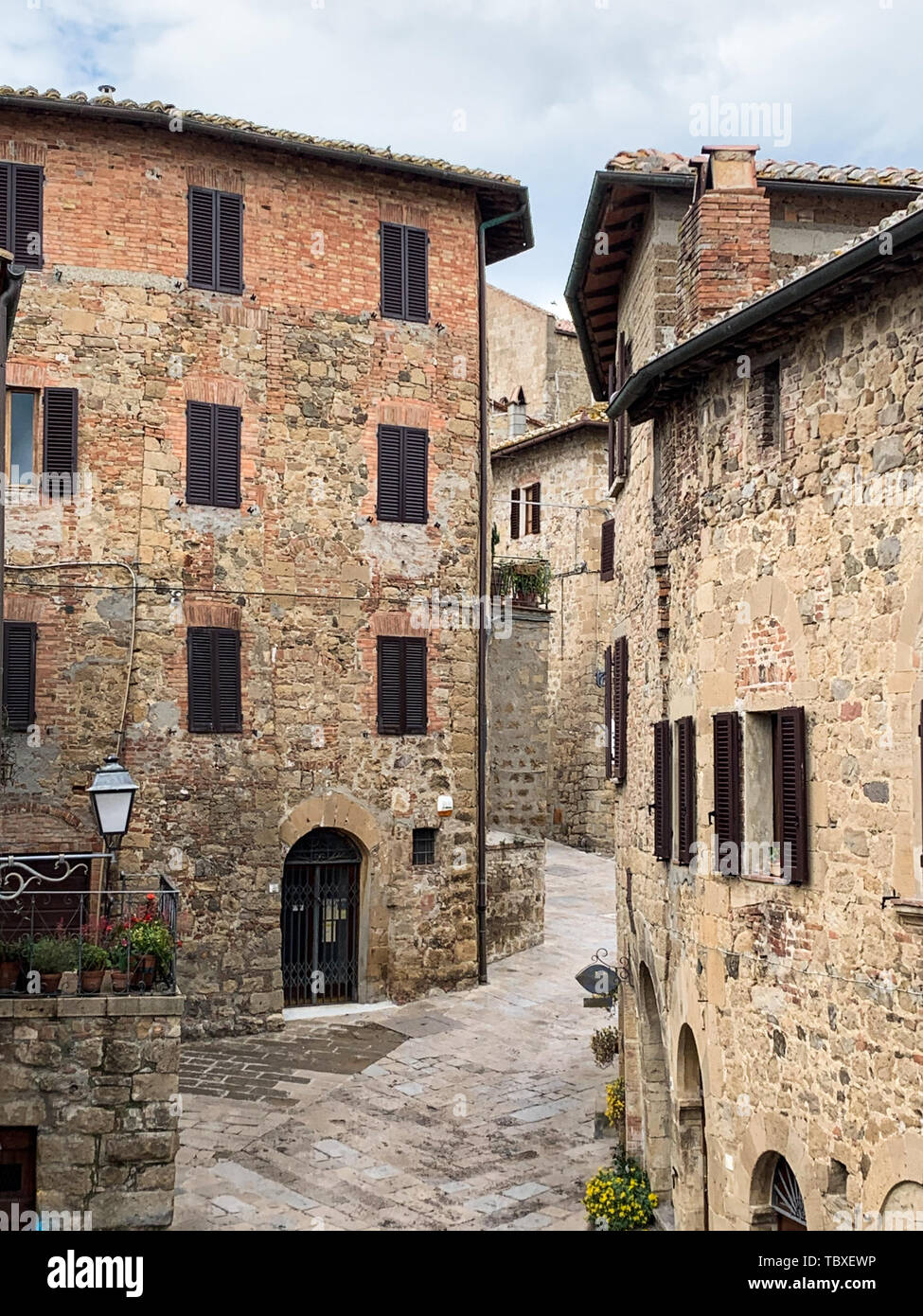 The characteristic stone houses of the medieval village of Pienza ...