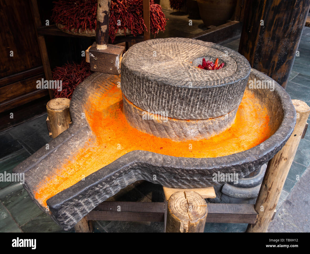 Stone grind of chili noodles. Stock Photo