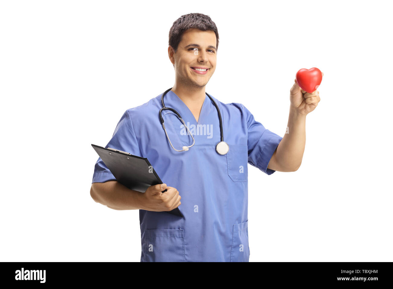 Young male doctor holding a small red heart isolated on white background Stock Photo