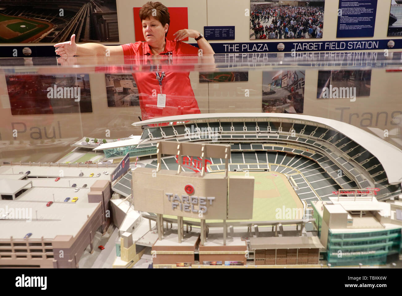 Female guide introducing the Target Field Baseball Stadium during the stadium tour with a model