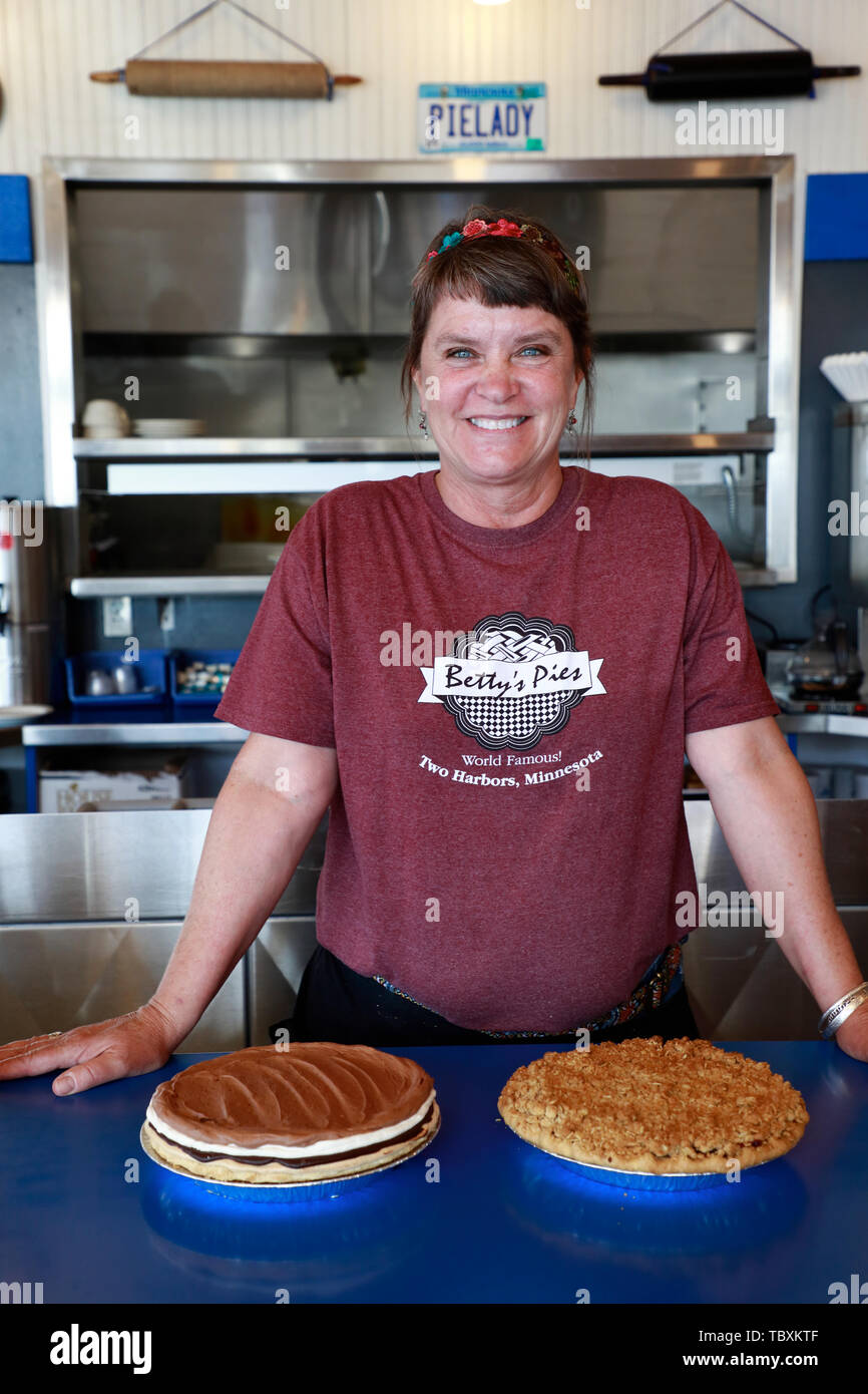 A waitress with pies in Betty's Pies a famous local bakery restaurant by the highway 61 in Two