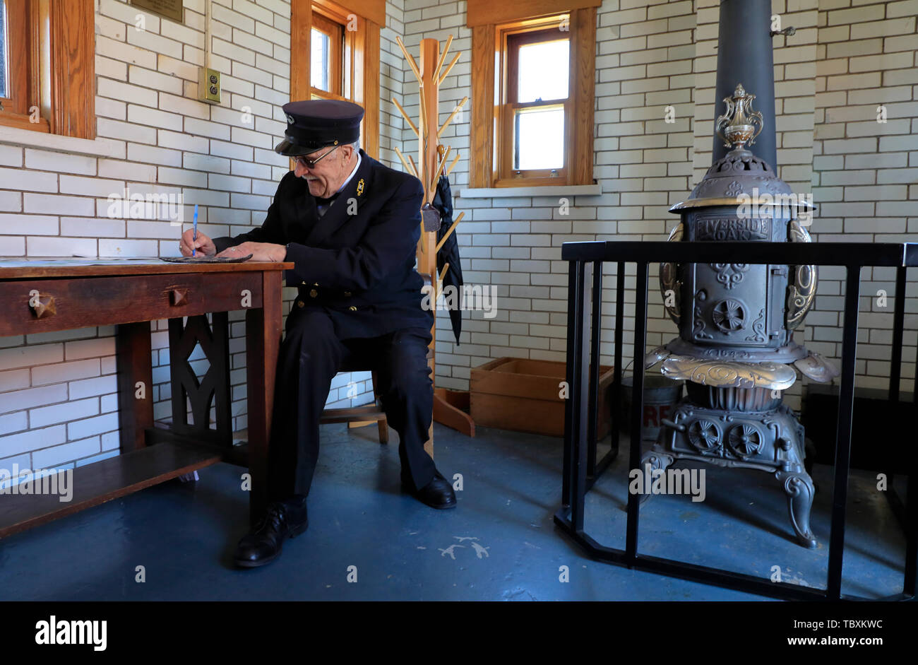 A male guide in traditional lighthouse keepers' uniform inside of Split