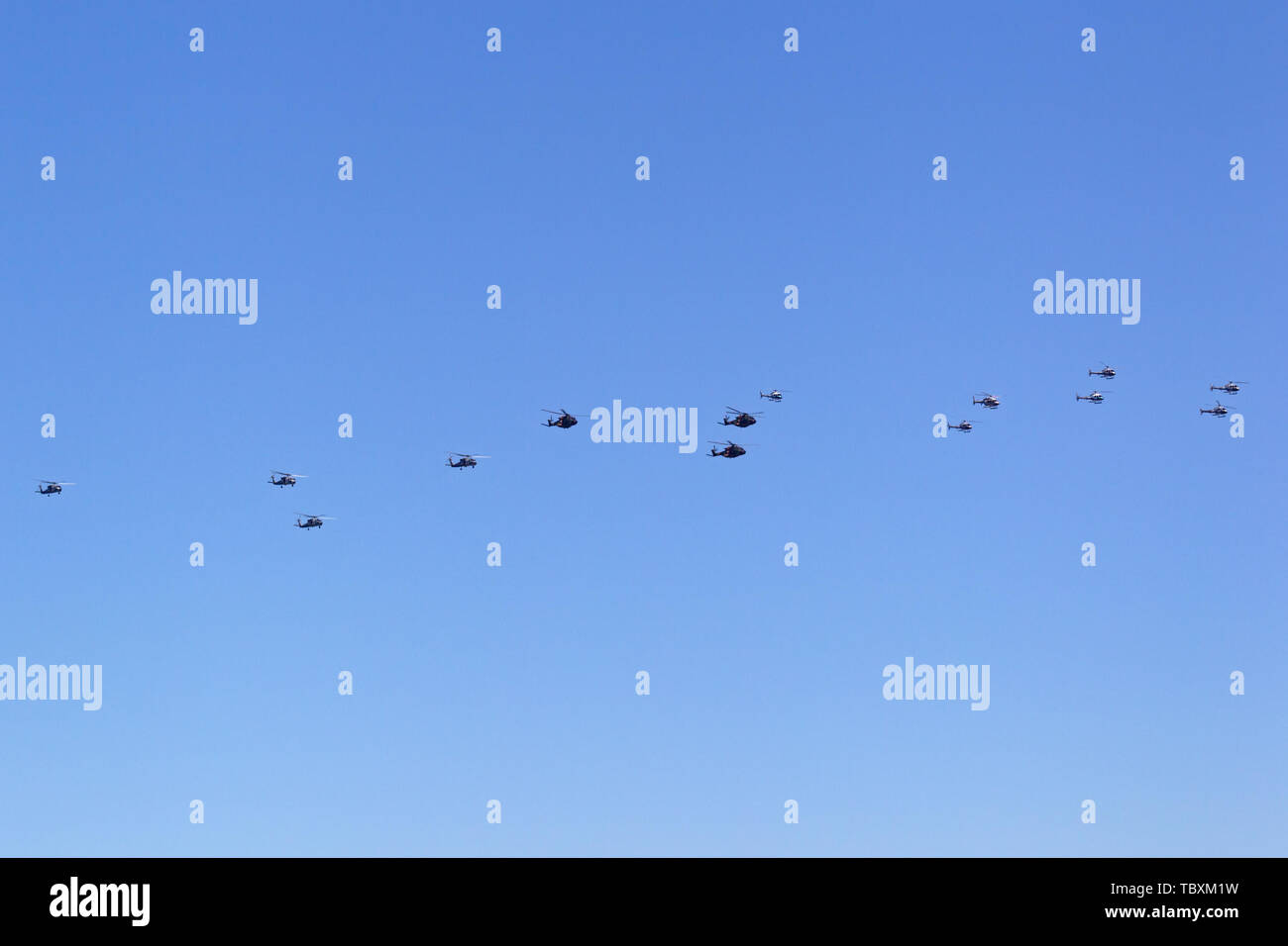 Mass formation of 14 Australian Military helicopters flying over Sydney Harbour. Stock Photo