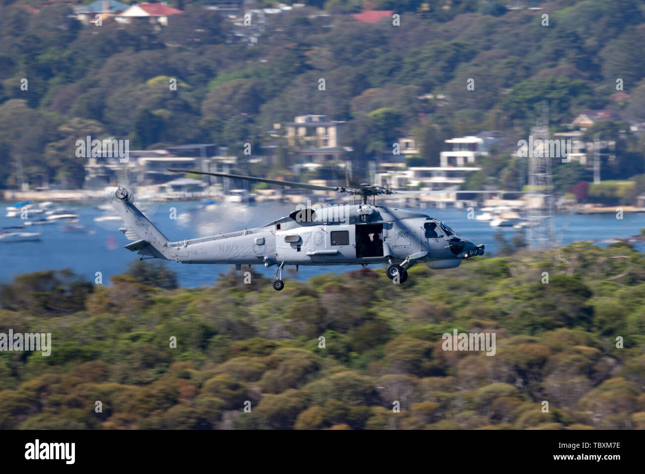 Royal Australian Navy (RAN) Sikorsky S-70B-2 Seahawk Helicopter N24-001 over Sydney Harbour. Stock Photo
