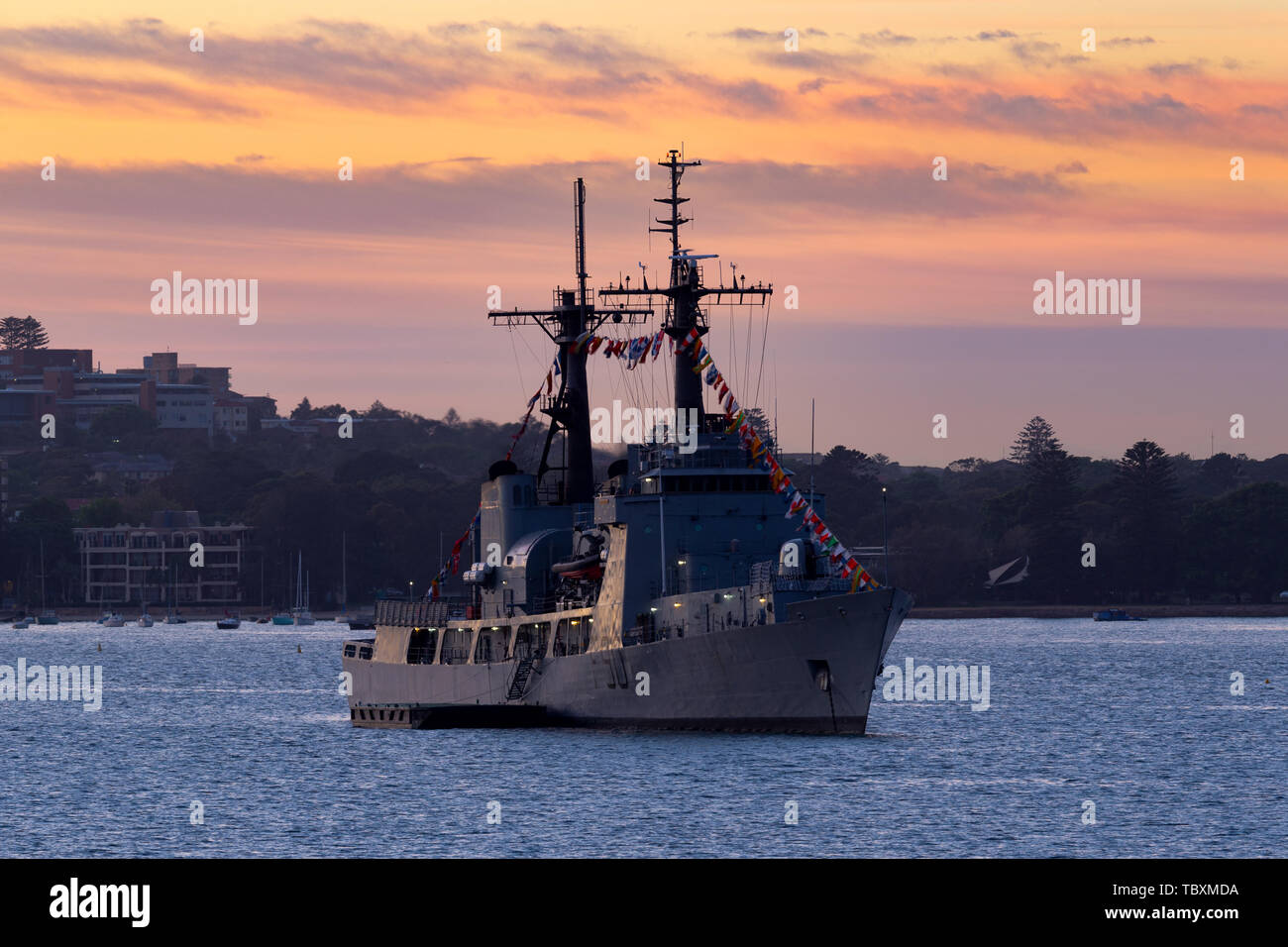 Nigerian Navy NNS Thunder (F90) Cutter (Former United States Coast Guard USCGC Chase, Hamilton-class cutter) at sunrise in Sydney Harbor. Stock Photo