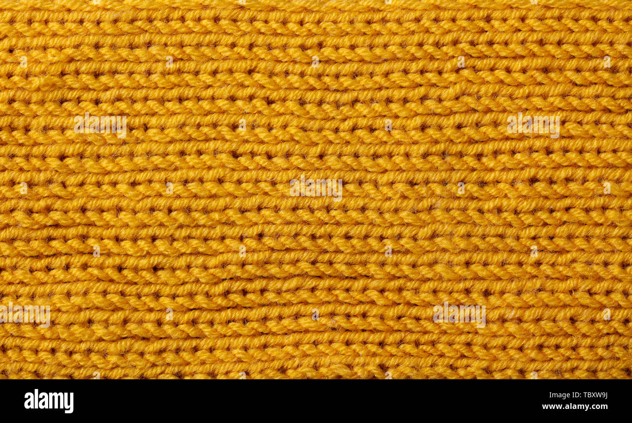 Yellow knitted wool texture background pattern with high resolution. Top view. Copy space. Stock Photo