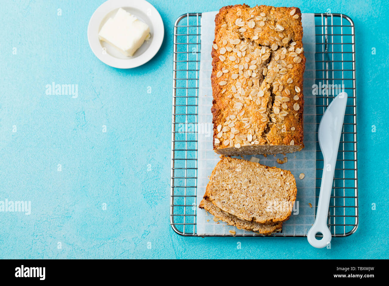 Healthy vegan oat, coconut loaf bread, cake on a cooling rack Blue ...
