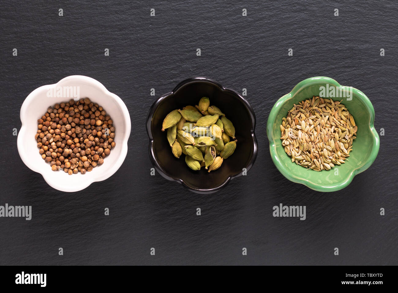 Food concept assortment Oriental spices cardamom pods, coriander seeds