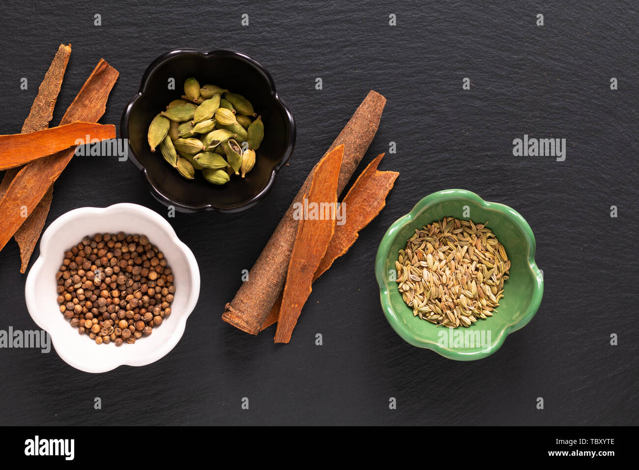 Food concept assortment Oriental spices cardamom pods, coriander seeds