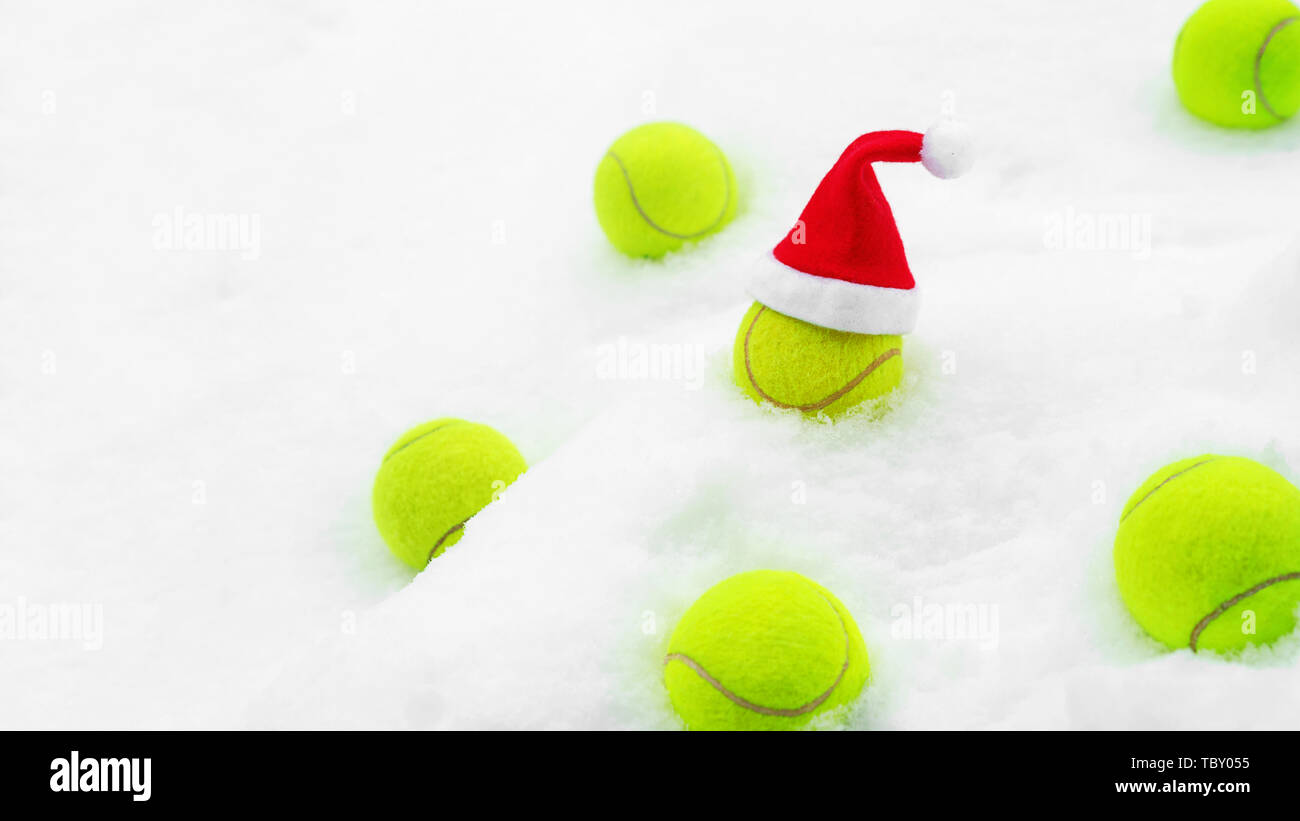Tennis winter concept with tennis balls on white snow Stock Photo - Alamy