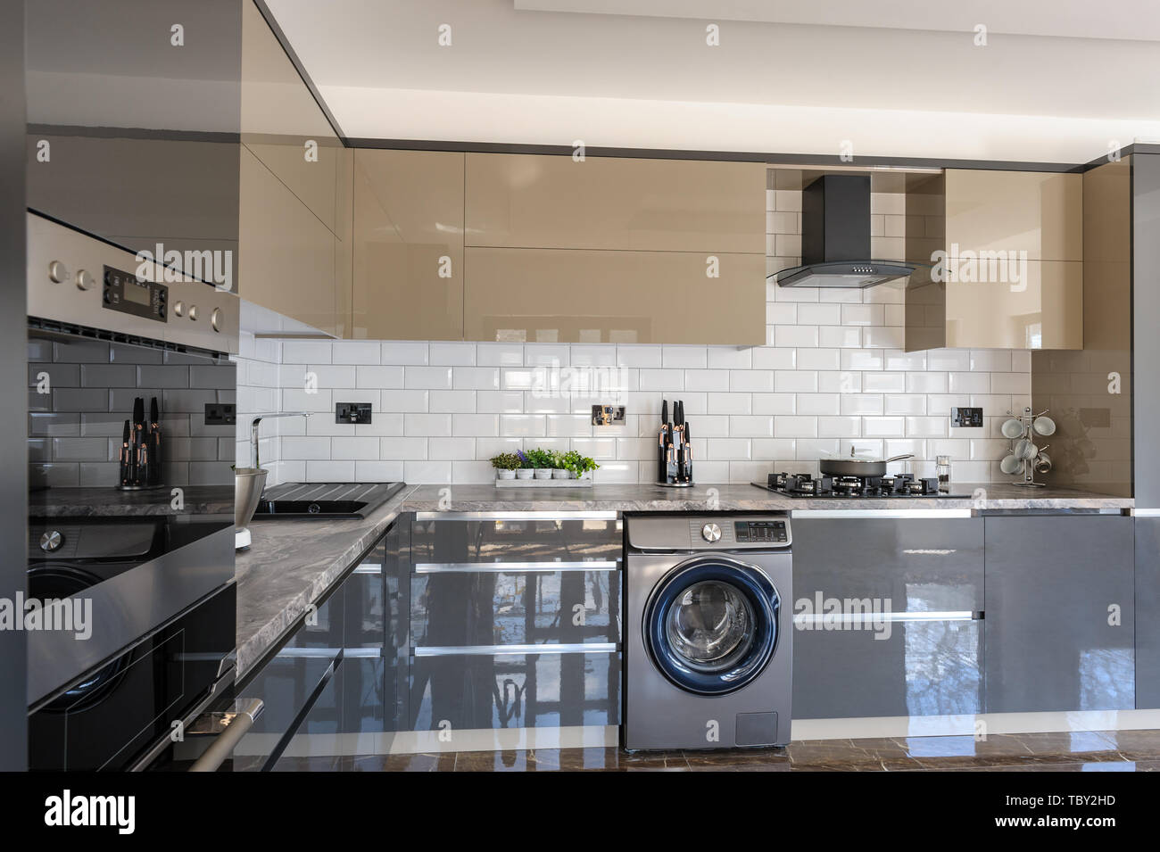 Luxury modern white, beige and grey kitchen interior Stock Photo - Alamy