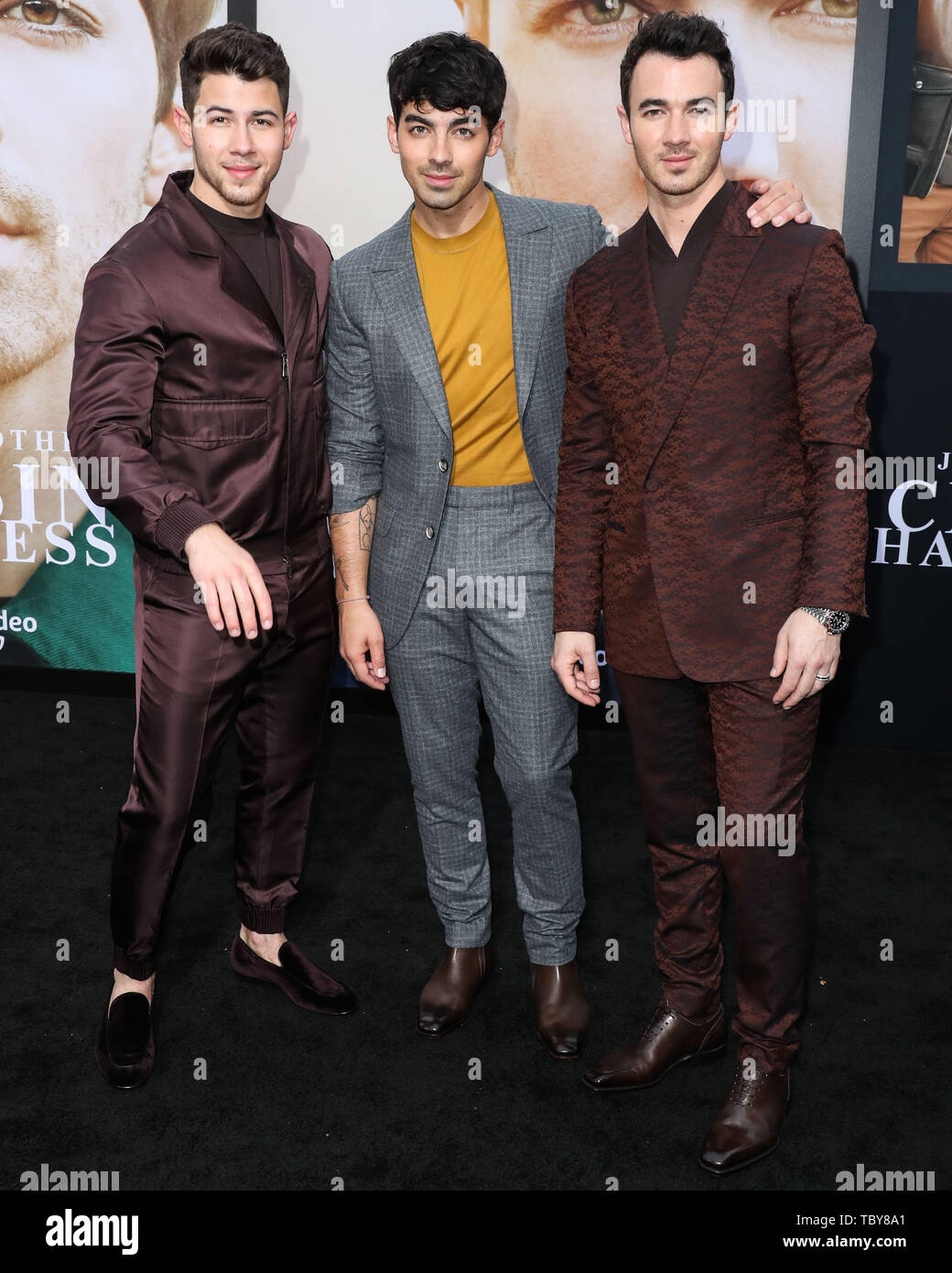 WESTWOOD, LOS ANGELES, CALIFORNIA, USA - JUNE 03: Singers Nick Jonas, Joe  Jonas and Kevin Jonas of Jonas Brothers wearing Ermenegildo Zegna XXX  arrive at the Los Angeles Premiere Of Amazon Prime