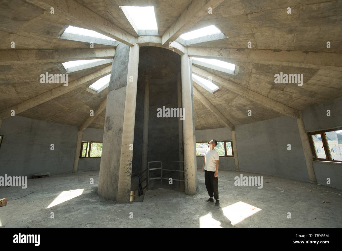 (190604) -- ANJI, June 4, 2019 (Xinhua) -- Photo taken on June 4, 2019 shows a library designed by Chen Gu in Anji, east China's Zhejiang Province. Chen Gu, born in 1971, has been working in design industry for more than 20 years. He started to re-design village houses after returning back to his hometown Anji. In 2014, Chen renovated a group of residential houses with the support of the local government. Since then, five guesthouses have been renovated and put into use. On his effort, the residential area once fallen has gradually become a guesthouse village equipped with accommodation, dinin Stock Photo