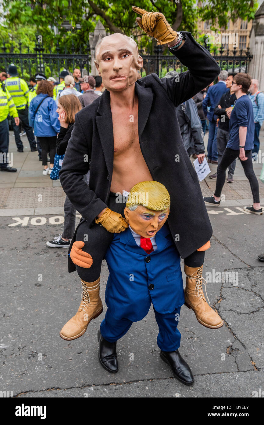 London Uk 4th June 2019 Putin Rides Trump People Protest The Visit Of Donald Trump The Us President In Parliament Square With The Aid Of A Giant Inflatable Trump Baby Credit