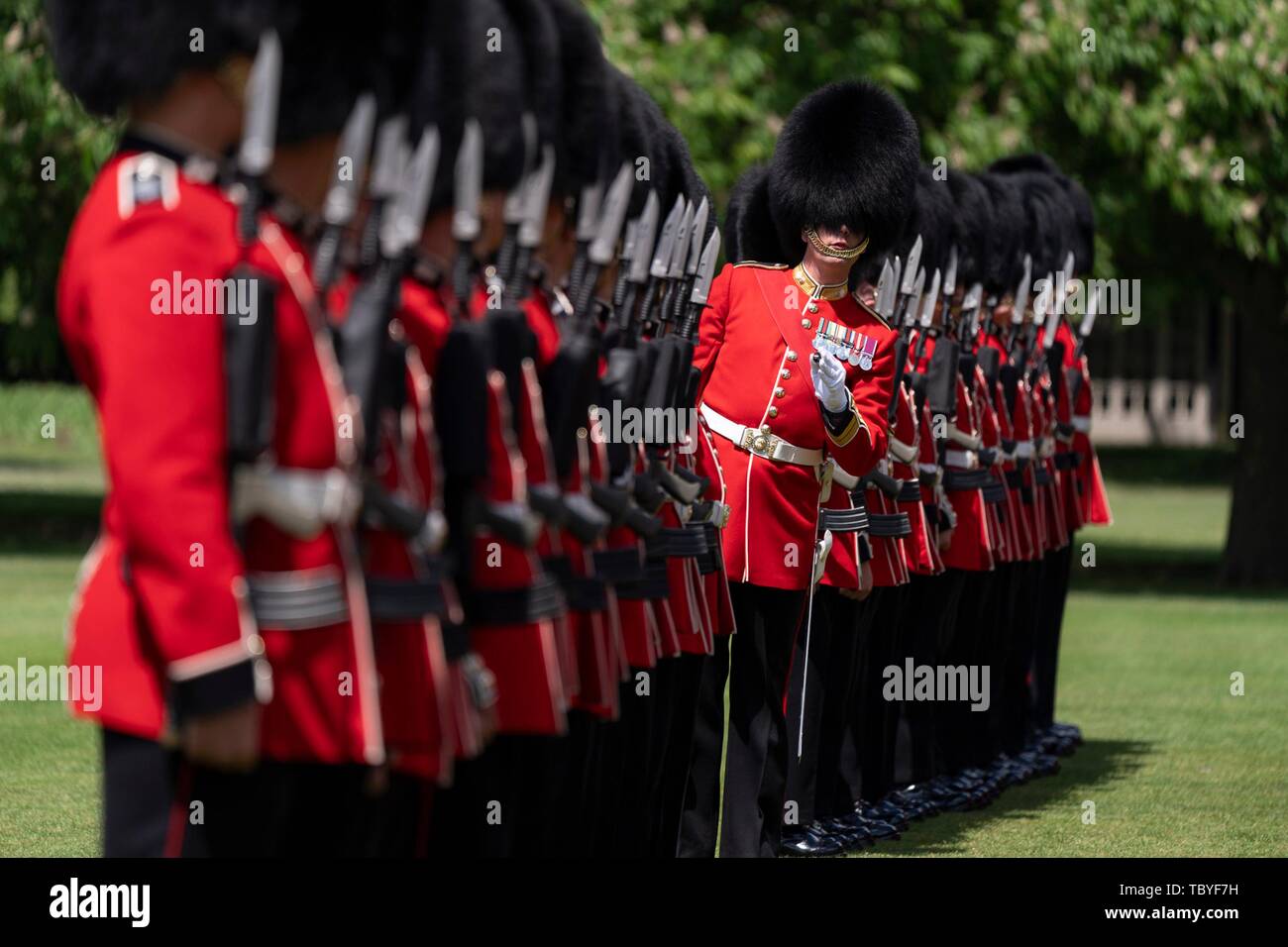 London, UK. 03rd June, 2019. The Queens Guards render a Royal Salute welcoming U.S President Donald Trump and First Lady Melania Trump during an official welcome ceremony at Buckingham Palace June 3, 2019 in London, England. Credit: Planetpix/Alamy Live News Stock Photo