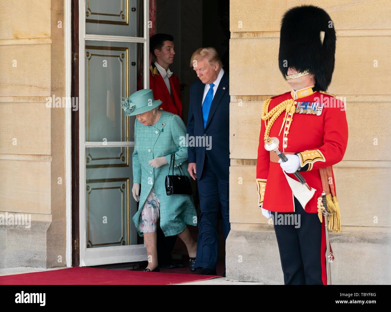 London, UK. 03rd June, 2019. U.S President Donald Trump walks alongside Queen Elizabeth II as they depart Buckingham Palace following the official welcoming ceremony June 3, 2019 in London, England. Credit: Planetpix/Alamy Live News Stock Photo