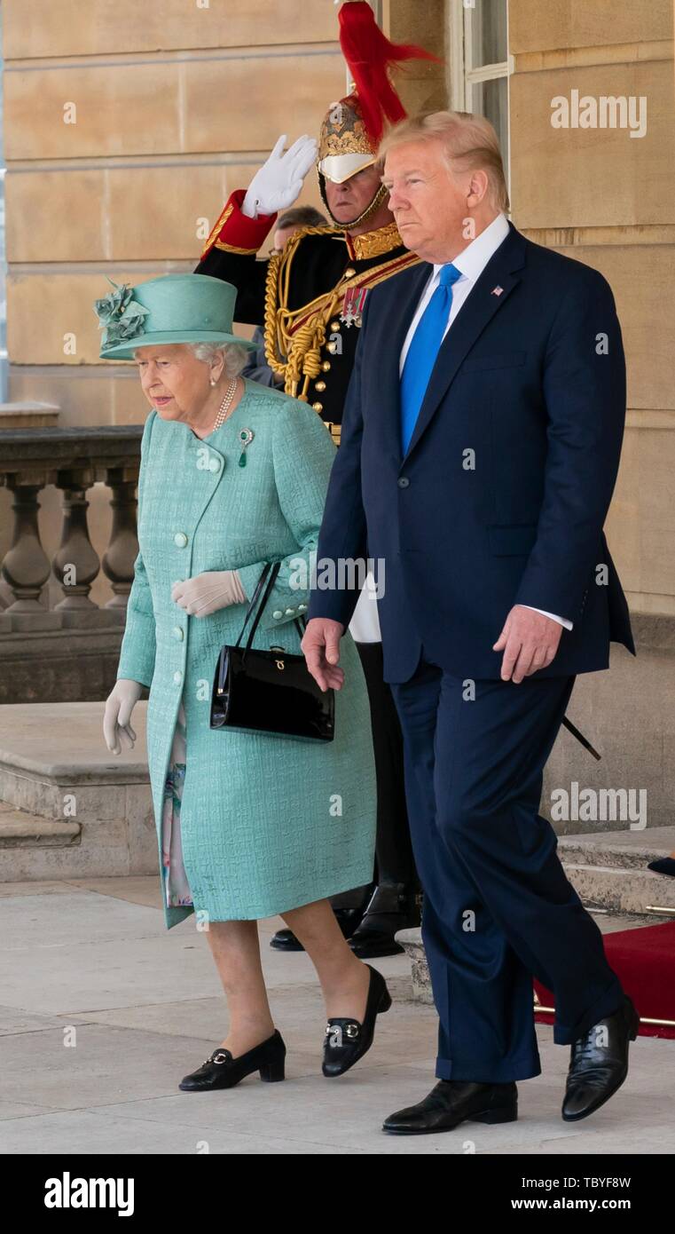 London, UK. 03rd June, 2019. U.S President Donald Trump walks alongside Queen Elizabeth II during the official welcoming ceremony at Buckingham Palace June 3, 2019 in London, England. Credit: Planetpix/Alamy Live News Stock Photo