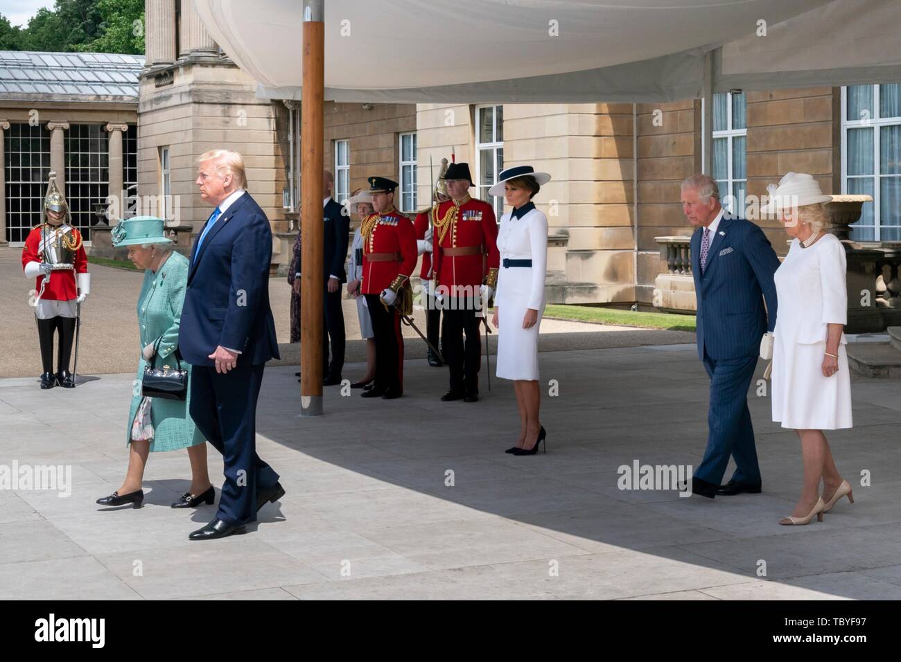 London, UK. 03rd June, 2019. U.S President Donald Trump, walks with Queen Elizabeth II as Prince Charles and the Duchess of Cornwall follow during the official welcoming ceremony at Buckingham Palace June 3, 2019 in London, England. Credit: Planetpix/Alamy Live News Stock Photo