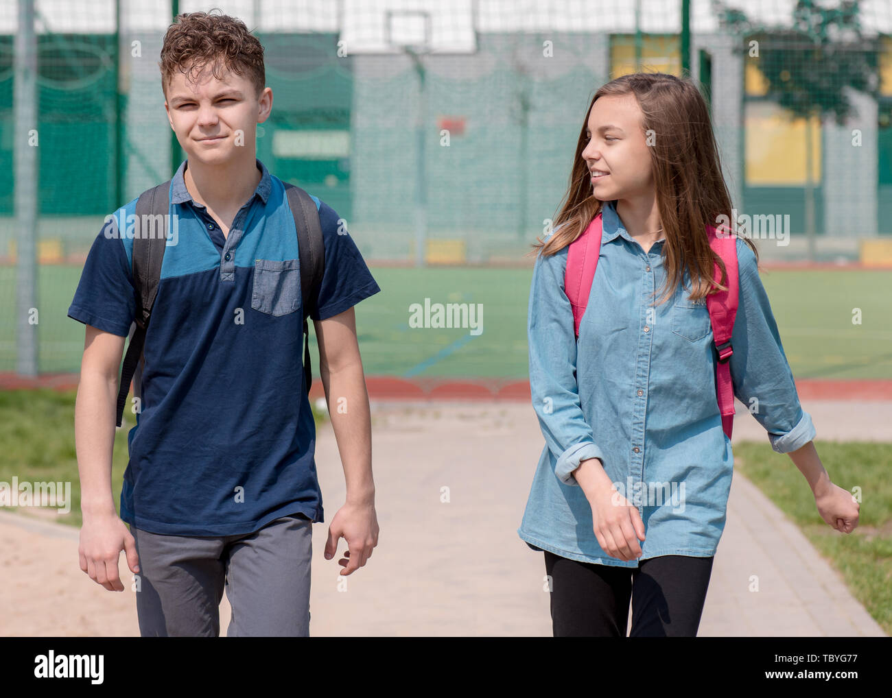 Teen boy and girl back to school Stock Photo - Alamy