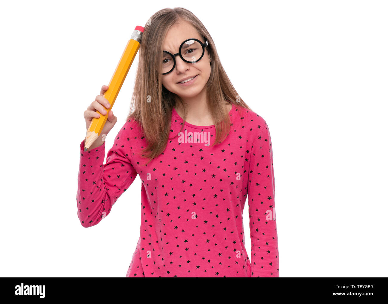Teen girl with big pencil Stock Photo