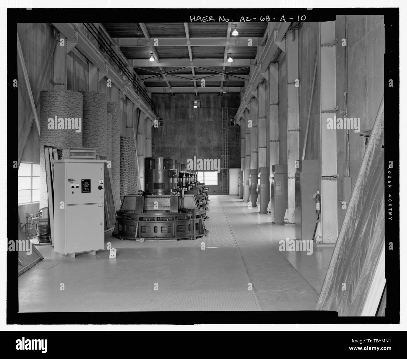 Motor Room, overall view to the west. The control cabinet and cement pipes along the south wall are being temporarily stored in the Pumping Plant and are not part of the original equipment  WelltonMohawk Irrigation System, Pumping Plant No. 1, Bounded by Gila River and Union Pacific Railroad, Wellton, Yuma County, AZ Stock Photo