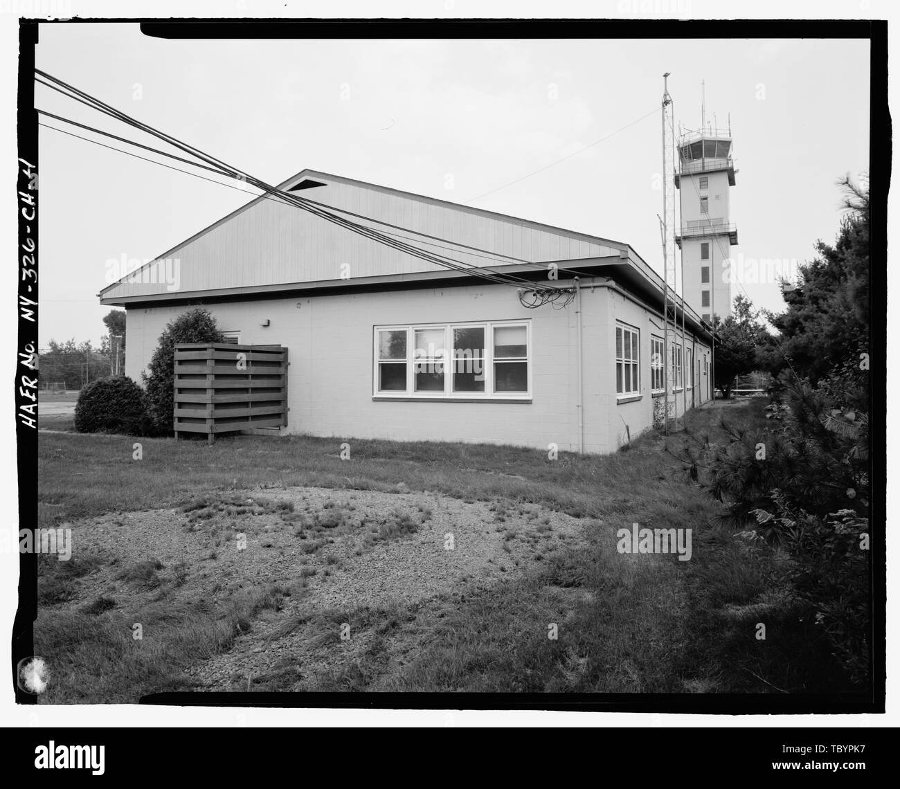 NORTH (SIDE) AND WEST (REAR) ELEVATIONS OF BUILDING. VIEW TO SOUTHEAST ...