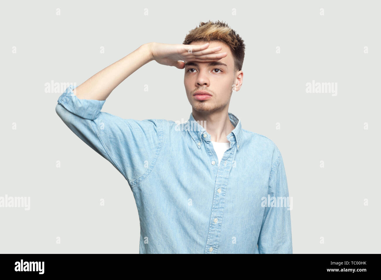 Young man blue eyes watching hi-res stock photography and images - Alamy