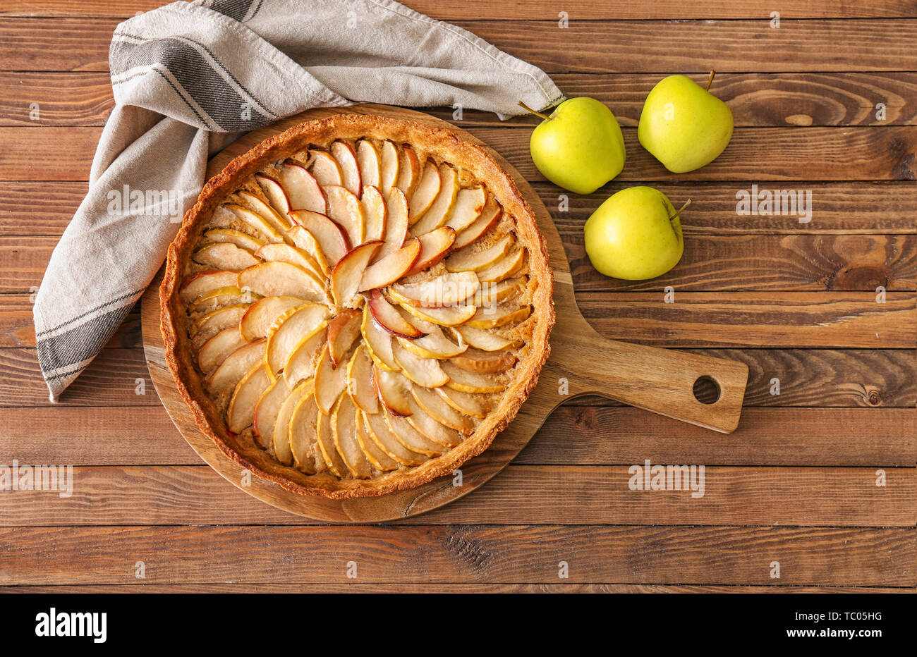 Tasty apple pie on wooden table Stock Photo - Alamy