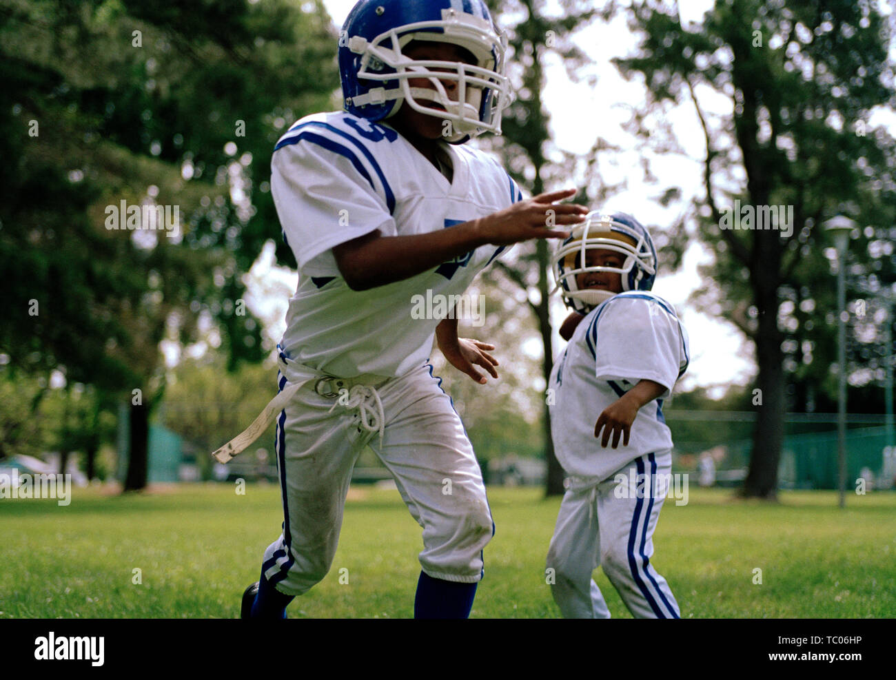 Young boys playing American Football Stock Photo Alamy