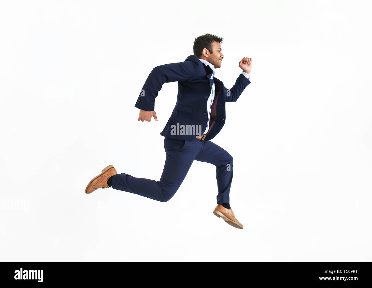 Running businessman against white background Stock Photo - Alamy